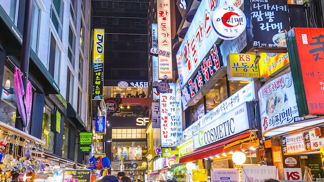 SEOUL, SOUTH KOREA - FEBRUARY 14, 2013: Myeong-Dong district at night. The location is the premiere district for shopping in the city.